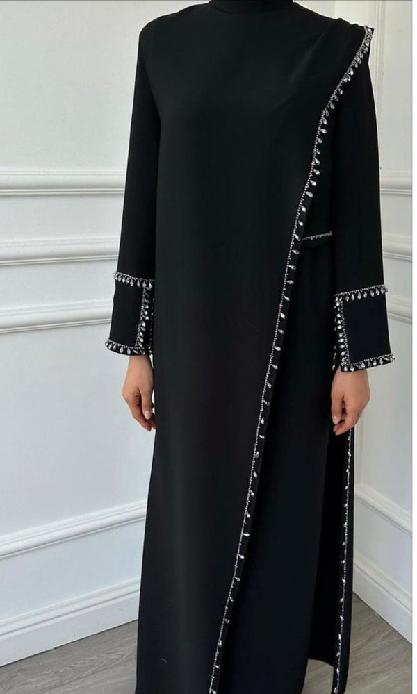 Shoma- A timeless Black Abaya that goes beyond trends - Wrap yourself in dignity, beauty, and meaning - The elegance of simplicity. The comfort of tradition.